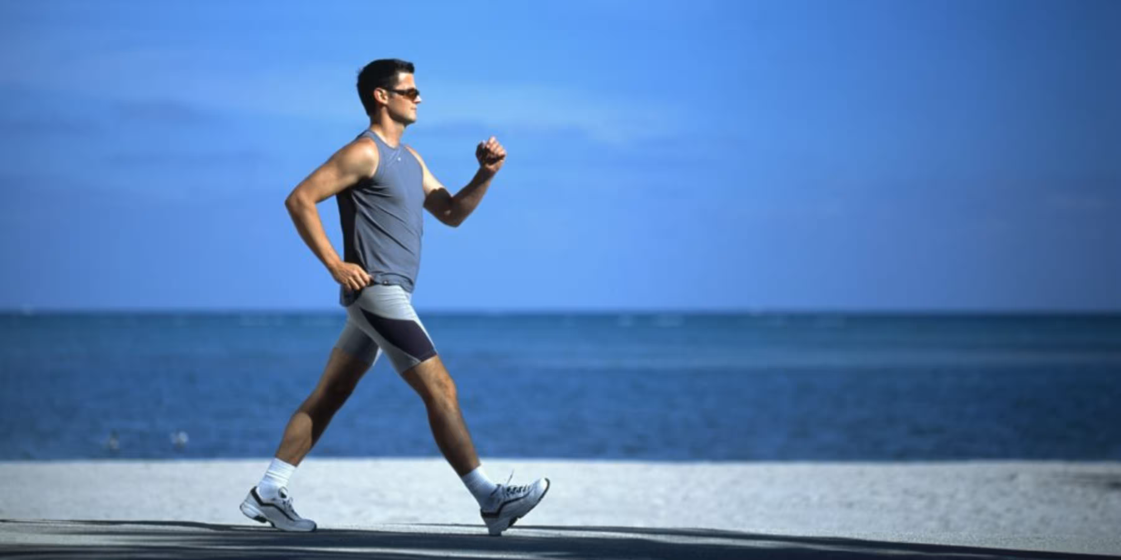 Man walking on natural path in park for exercise and circulation improvement